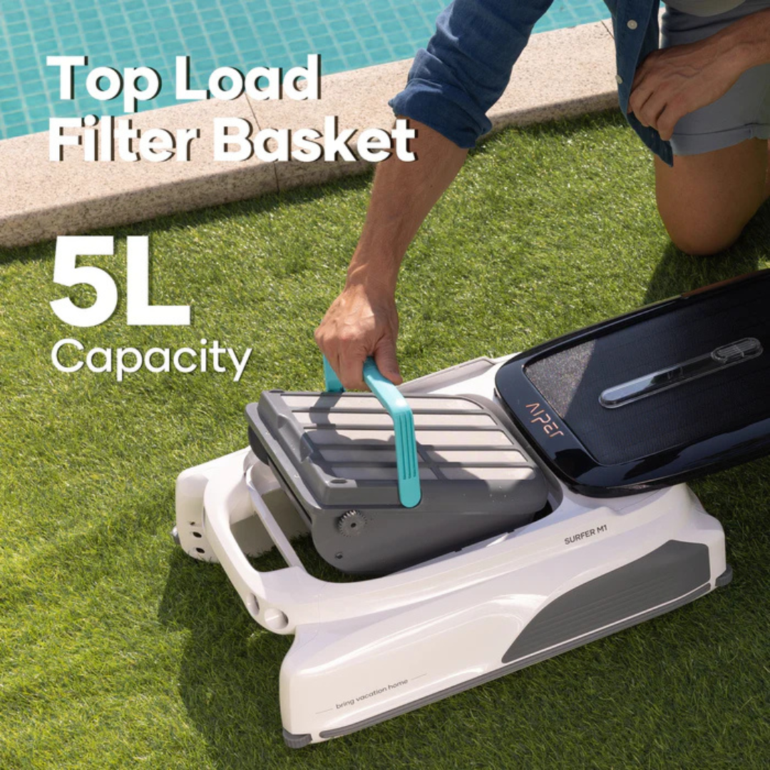 Infographic lifestyle view showing a person lifting the 5L top-load debris filter basket by its teal handle from the Aiper Surfer M1 robotic pool skimmer resting on artificial lawn by the pool.