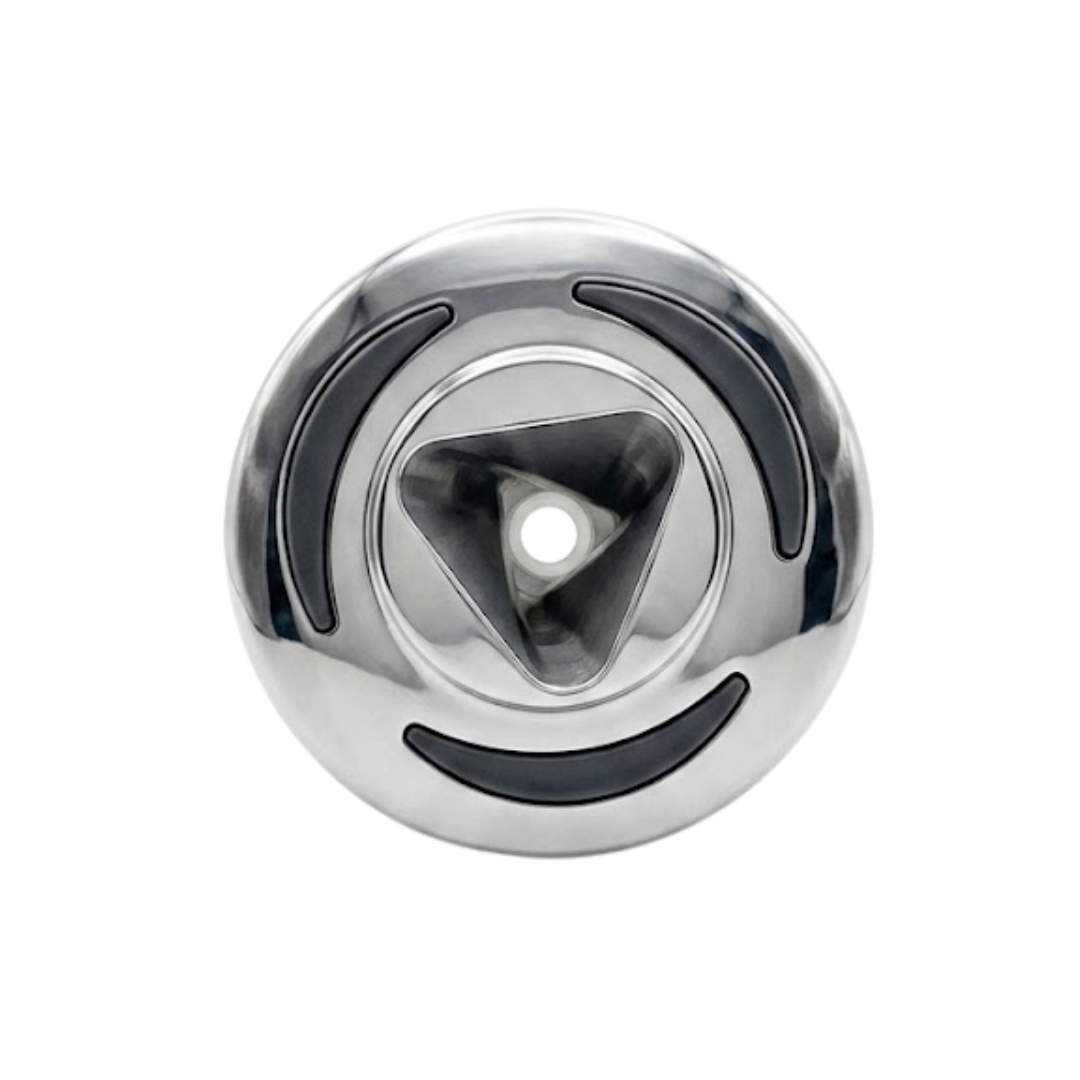 Direct overhead front view of an Artesian C-Helix 2.75 SS spa jet insert, featuring a polished stainless steel bezel with three curved dark grip accents and a central triangular orifice opening.