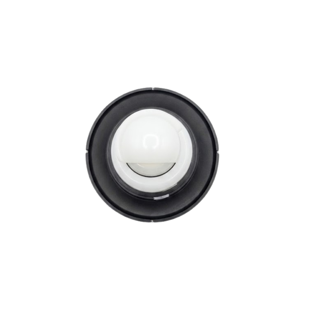 Direct overhead bottom-up view of the rear assembly on an Artesian C-Helix 5 Whirlpool SS spa jet insert, showing the dark grey outer face flange ring and central white plastic stem.