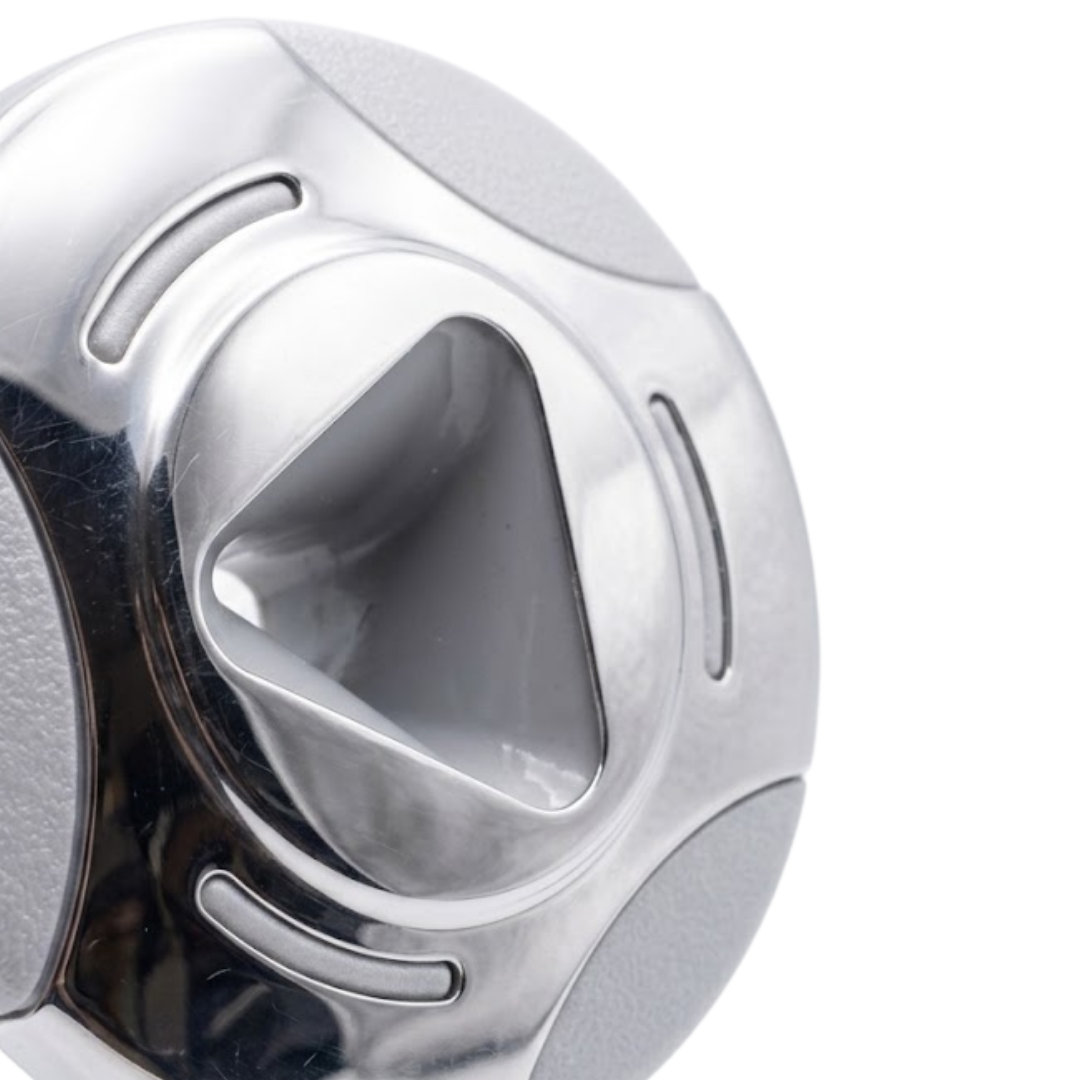 Close-up angled view of an Artesian Cluster SS PE 2.75 spa jet insert face, showing the polished stainless steel bezel, textured grey accent panels, and deep triangular center nozzle opening.