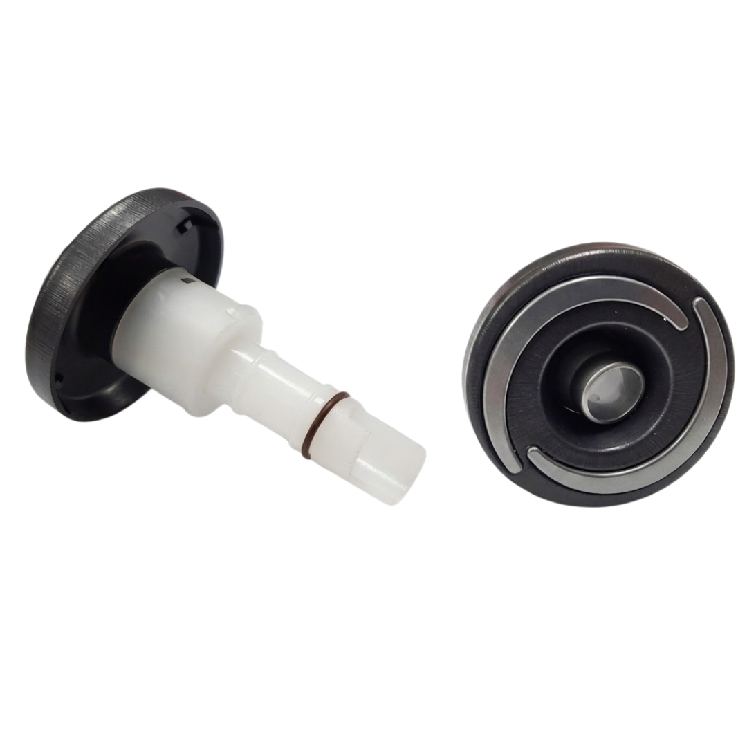 Dual product view of two Artesian Halo 2 Directional plastic spa jet inserts, displaying one jet angled to show the translucent white body stem with rubber O-ring alongside a second jet showing the direct front face with textured black bezel, grey swirl accents, and directional eyeball nozzle.