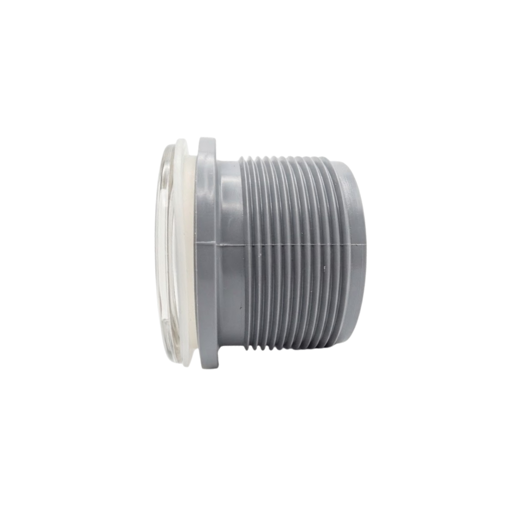 Side profile view of the Artesian 2-inch Xylex/PVC light lens body assembly, displaying the clear front lens cap, translucent sealing gasket, and grey threaded rear socket casing isolated on white.
