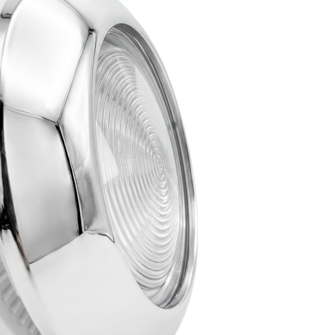 Angled close-up view of the polished stainless steel rim and ribbed glass lens face of an Artesian 5-inch spa light housing assembly.