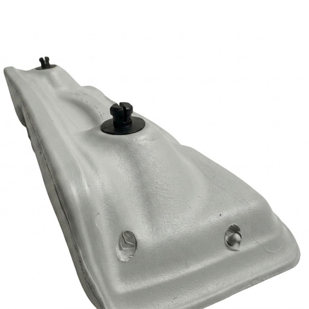 Close-up structural view of the reverse side of a light grey foam replacement lounger headrest pillow for an Artesian hot tub, focusing on the split black snap-in fastener peg and molded structural backing.