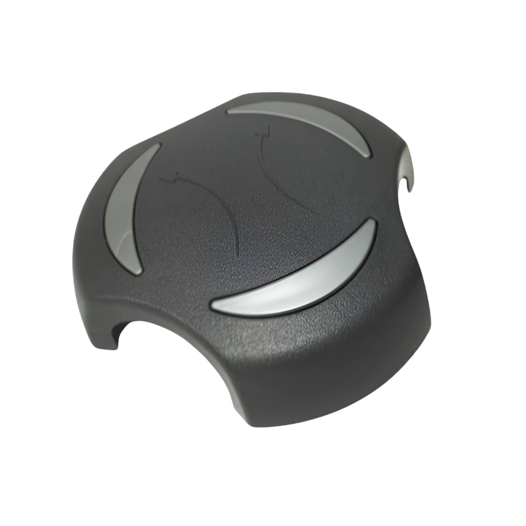 A high angled three quarter view of a black 2 inch Artesian Spas diverter valve replacement handle showing the textured surface grain and metallic grey crescent accents