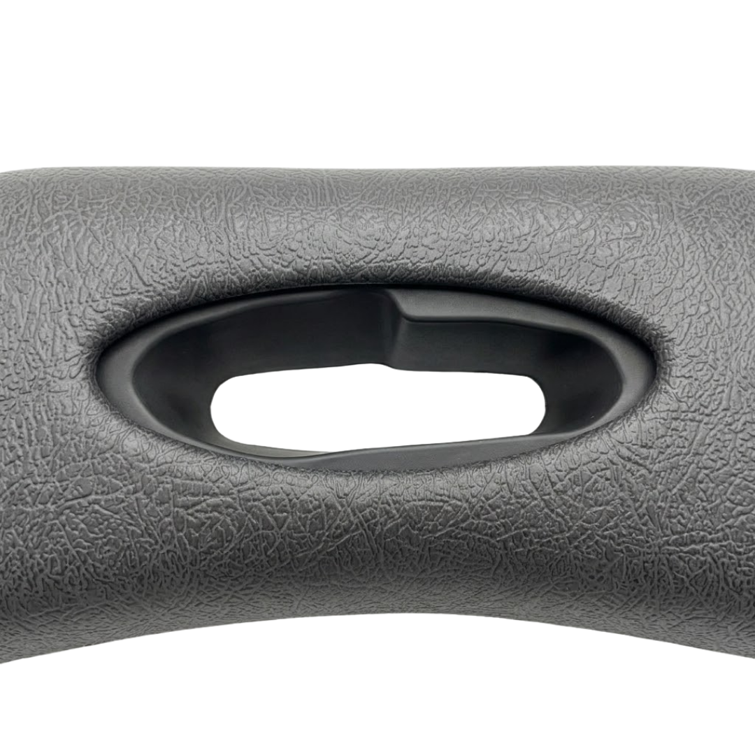 Close-up texture view of an premium Artesian Spas Platinum Elite series 11-inch replacement headrest pillow in dark charcoal gray, highlighting the textured material and central oval cutout.