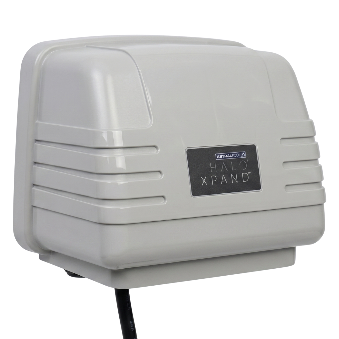 Three-quarter side view of the AstralPool Halo Xpand pool automation expansion unit, highlighting the casing design and bottom cord outlet against a white background.