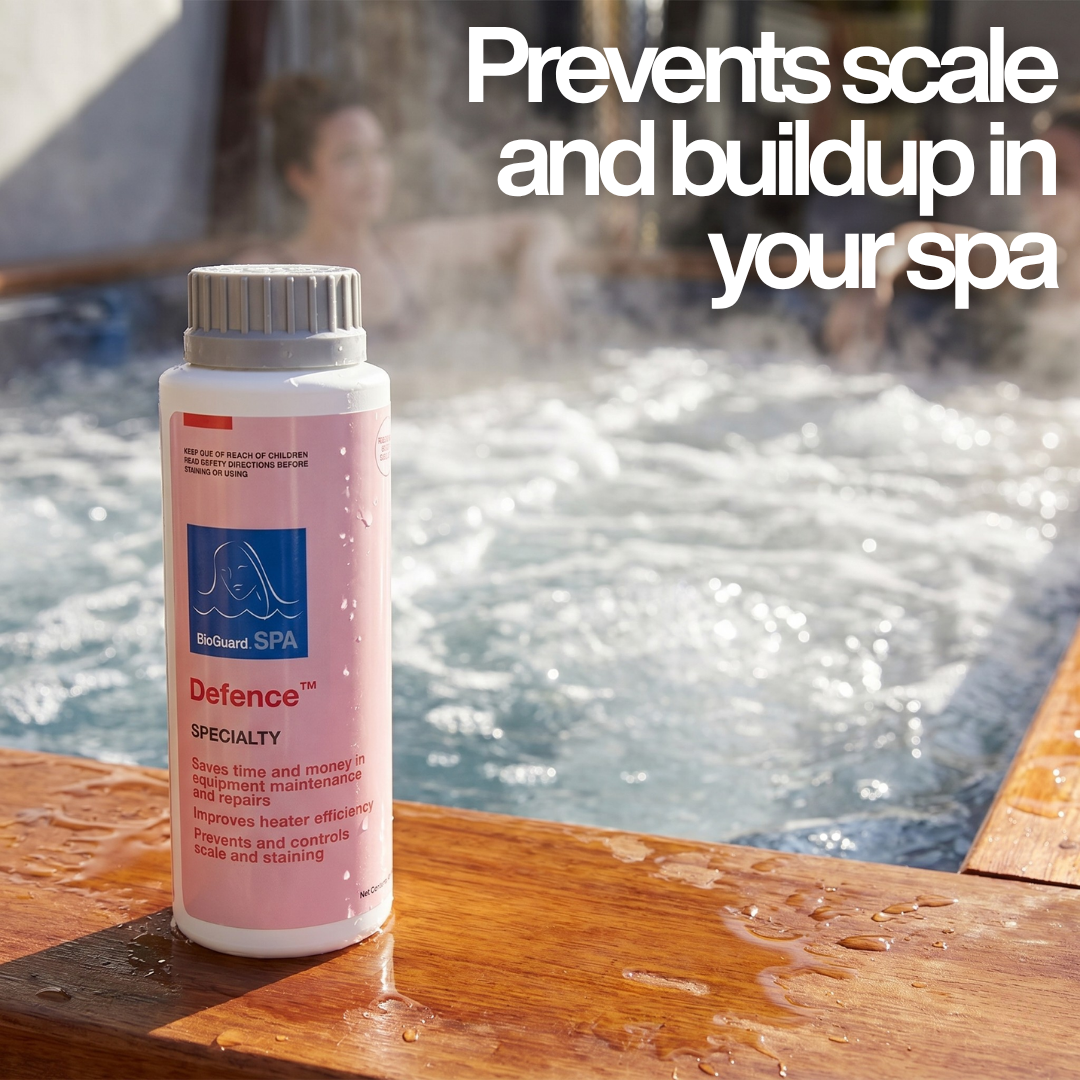 A bottle of BioGuard SPA Defence Specialty treatment sits on a wet wooden ledge next to a steaming outdoor hot tub with bubbling water and people relaxing in the background