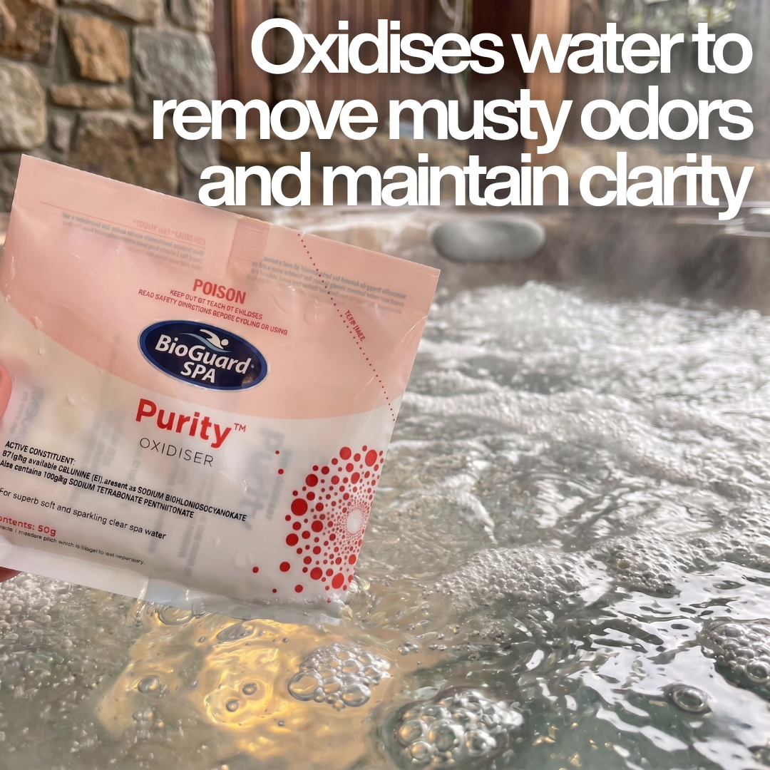A hand holding a 50g sachet of BioGuard Spa Purity Oxidiser above a bubbling, steaming hot tub, with text overlay explaining that it oxidises water to remove musty odors and maintain clarity.