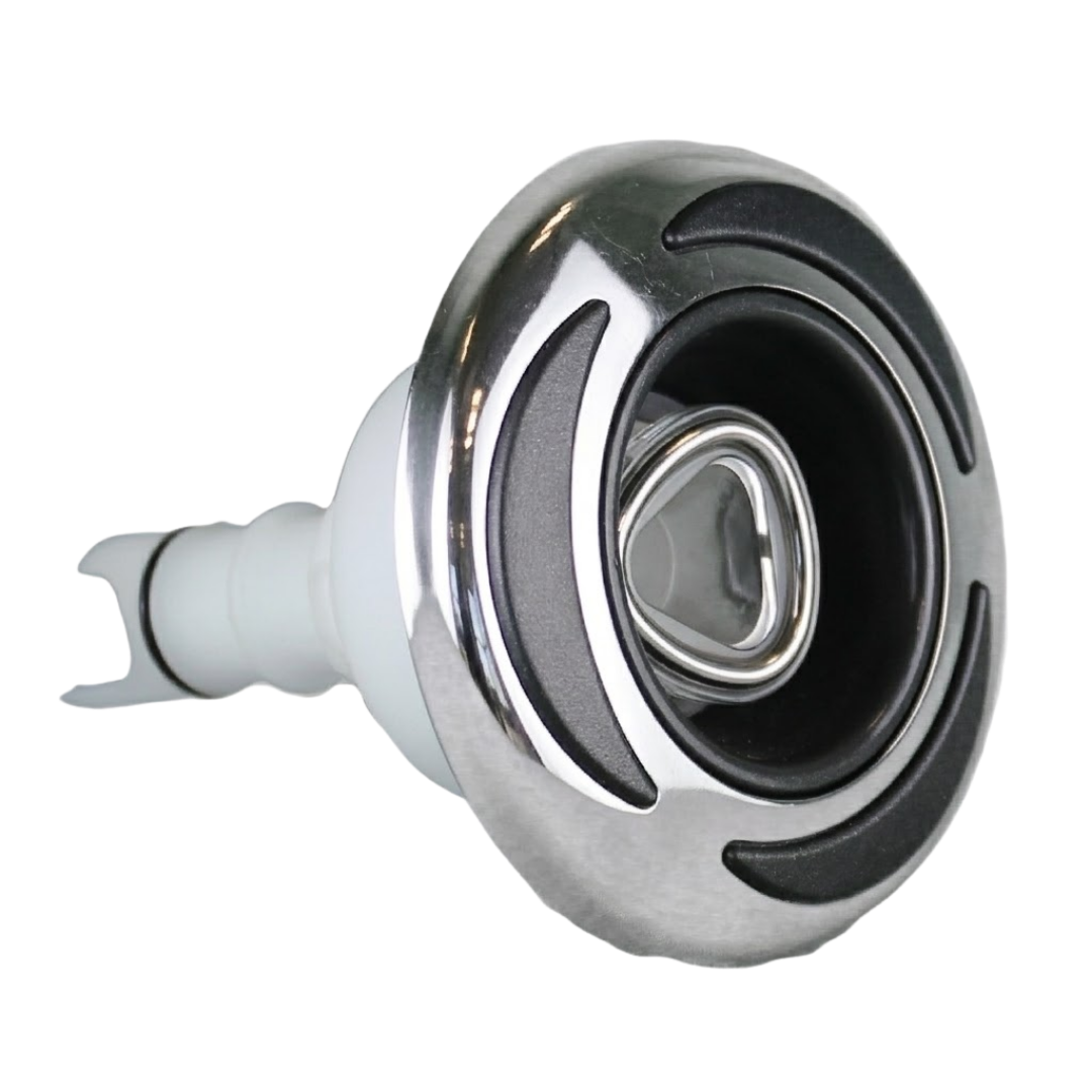 Three-quarter front profile view of a C-Helix 3 Directional SS spa jet internal insert, showing its stainless steel bezel with three black crescent accents, central eyeball-style directional nozzle, and white plastic rear stem.