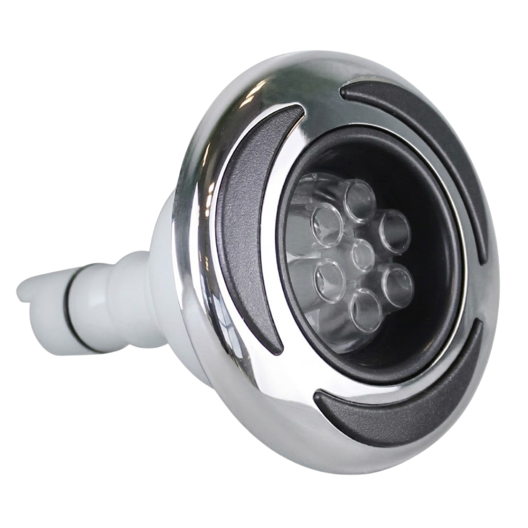 Three-quarter front profile view of a C-Helix 3 MSSG SS spa jet internal insert, showing its stainless steel bezel with black crescent accents, multi-port clear massage nozzle cluster, and white rear stem.