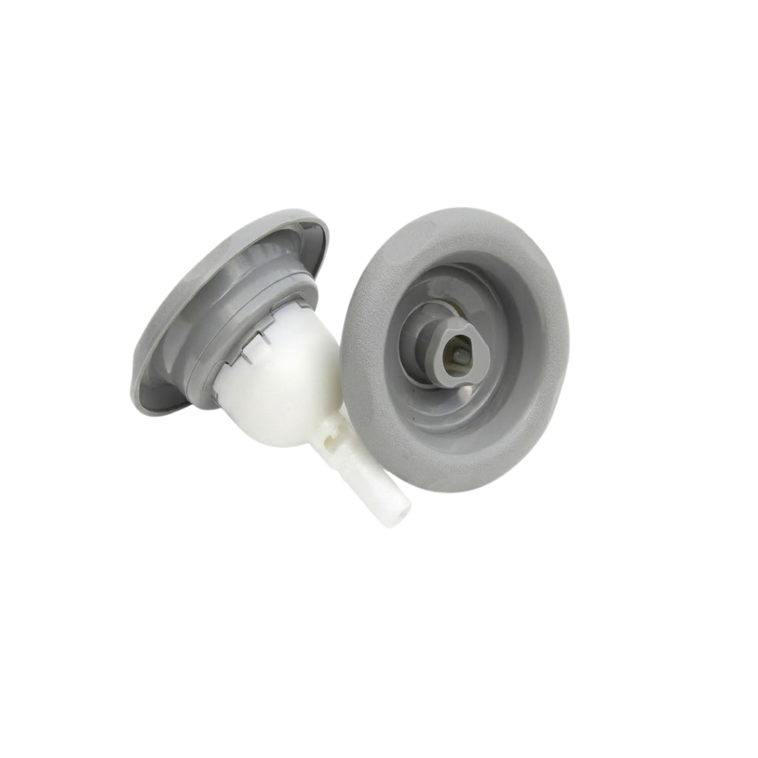 Studio view of two grey Cyclone adjustable swirl spa jet internal inserts side-by-side, one angled to display the rear white body and stem, and one upright revealing the front textured bezel and central rotational nozzle.