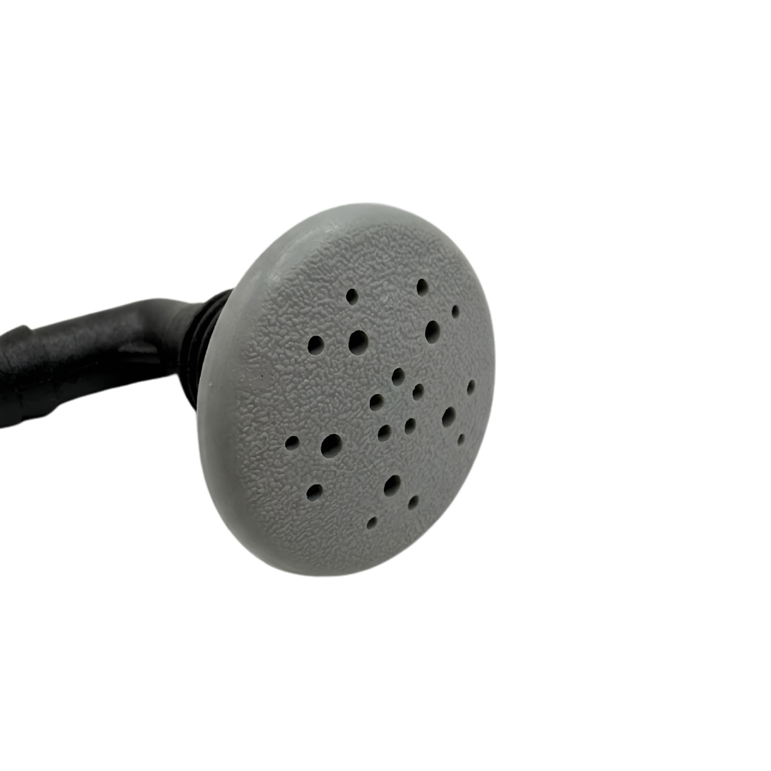 Close up front view of a grey Edgetec O2 spa air injector highlighting the round textured face cap with its distinctive multi hole spray pattern