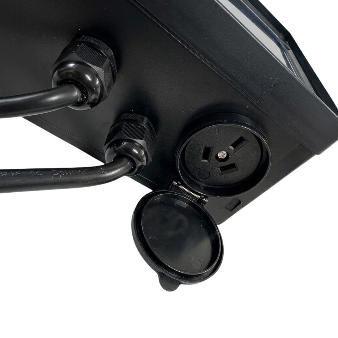 Close-up view of the open weather-resistant power socket and cable glands on the bottom of the EvoHeat Evo Connect heat pump controller.