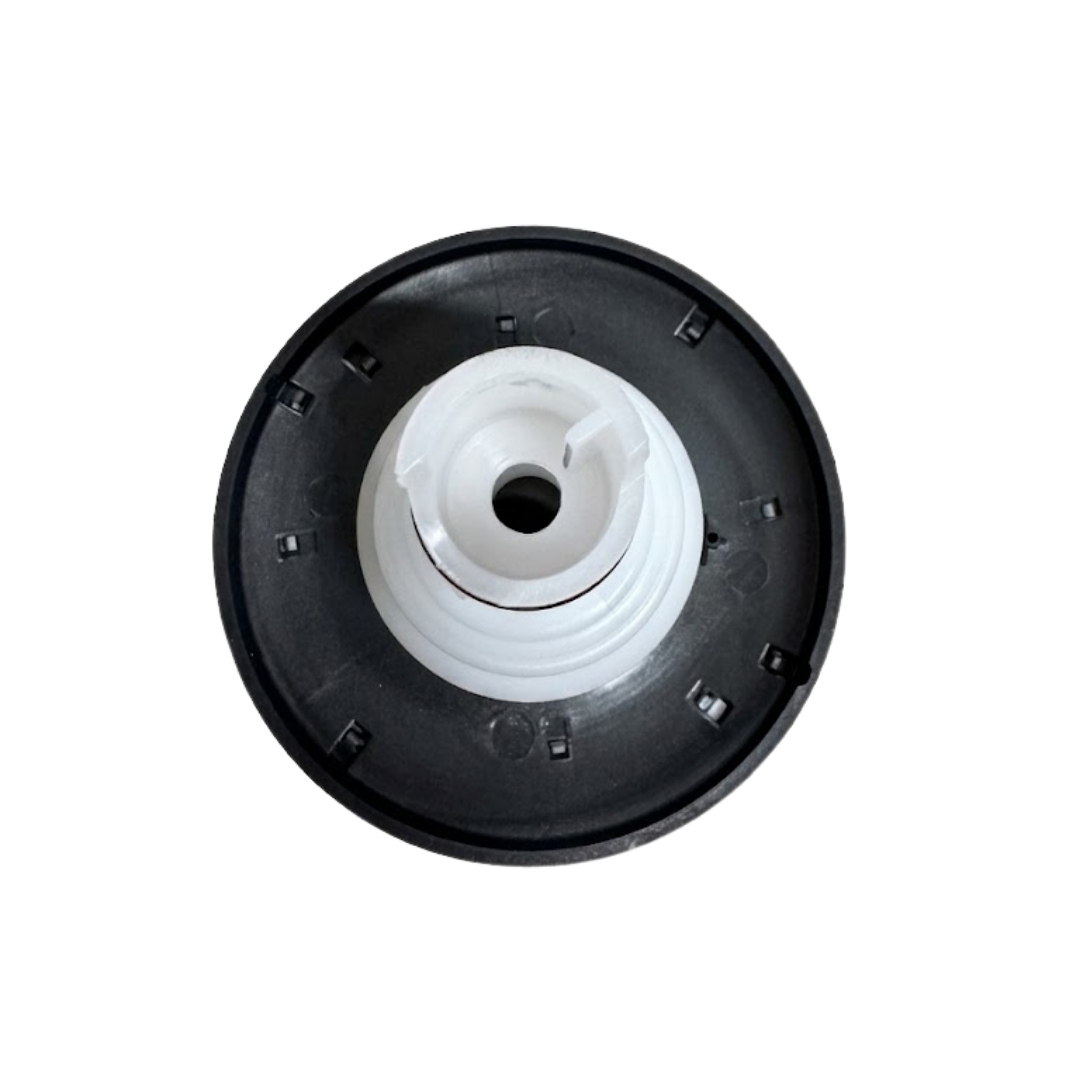 Direct overhead bottom-up view of the rear of a Halo 4.5 ROTO plastic spa jet internal insert, showing a dark circular outer flange back and a central white plastic intake port opening.