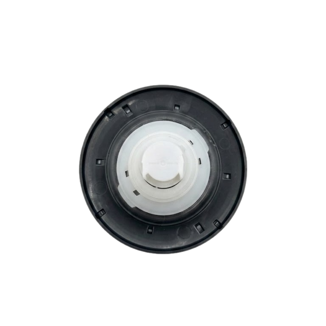 Direct overhead bottom-up view of the rear of a Halo 5 ROTO plastic spa jet internal insert, showing the dark circular face flange back and concentric white body stem assembly.