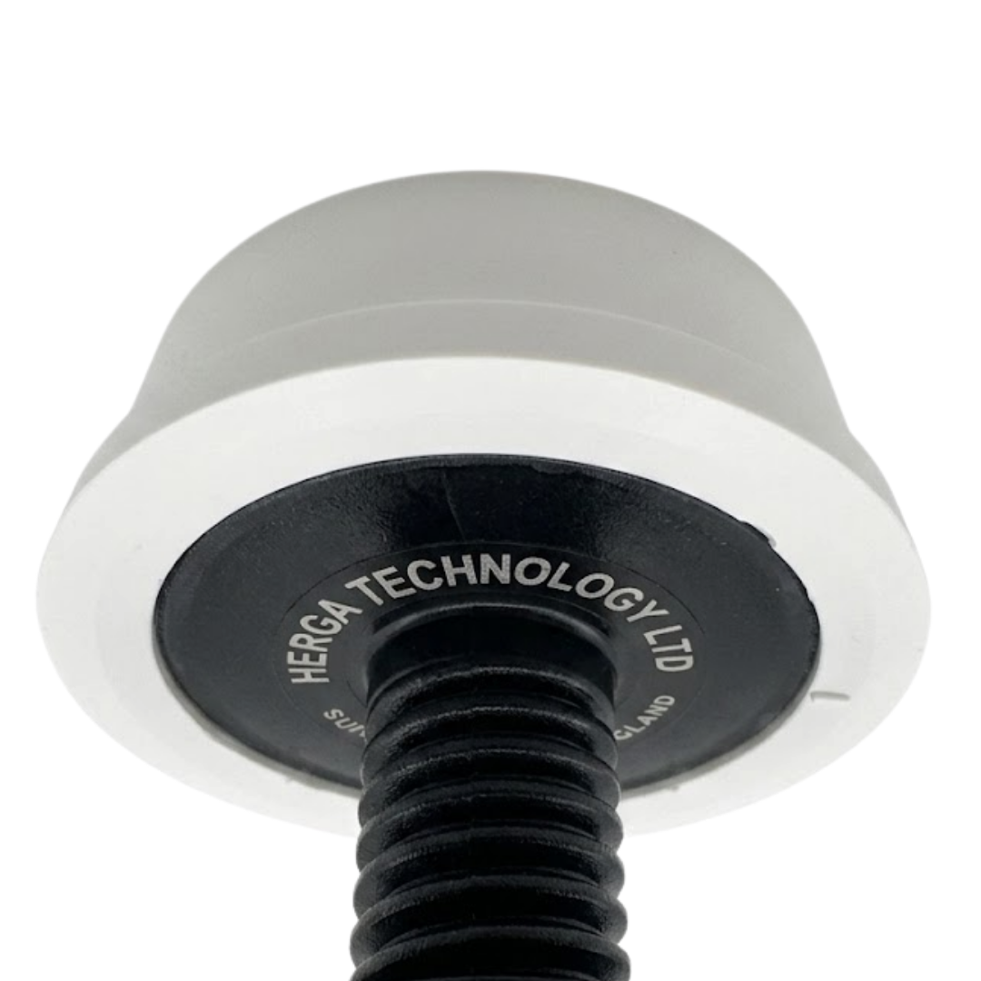 A close up underside perspective of a white Herga spa air switch button showing the printed Herga Technology Ltd manufacturer text on the black base plate and the black threaded plastic stem