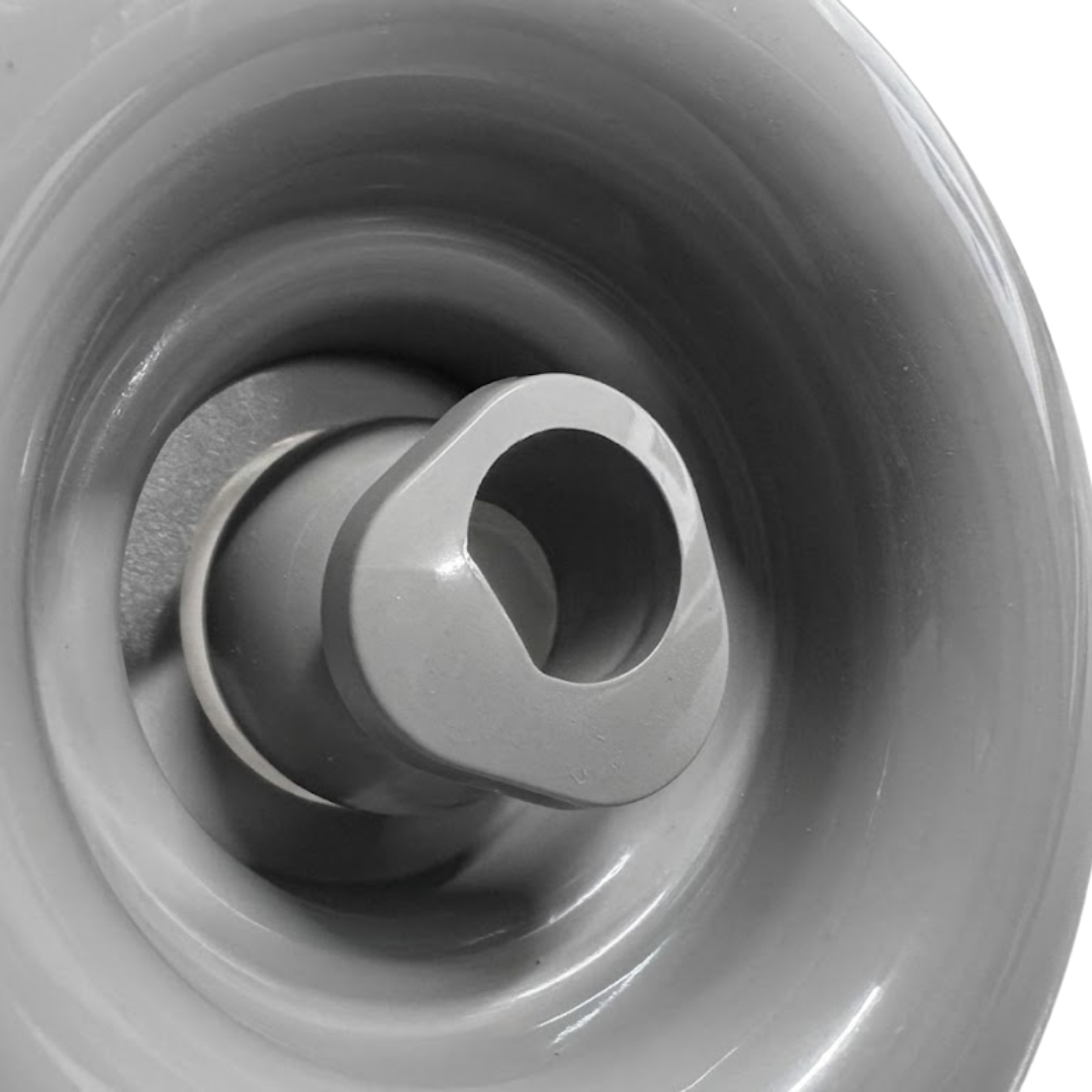 Close-up view of the central rotational nozzle on a grey HydroAir adjustable VSR spa jet internal insert, showing its directional outlet tip within a smooth circular inner bezel.
