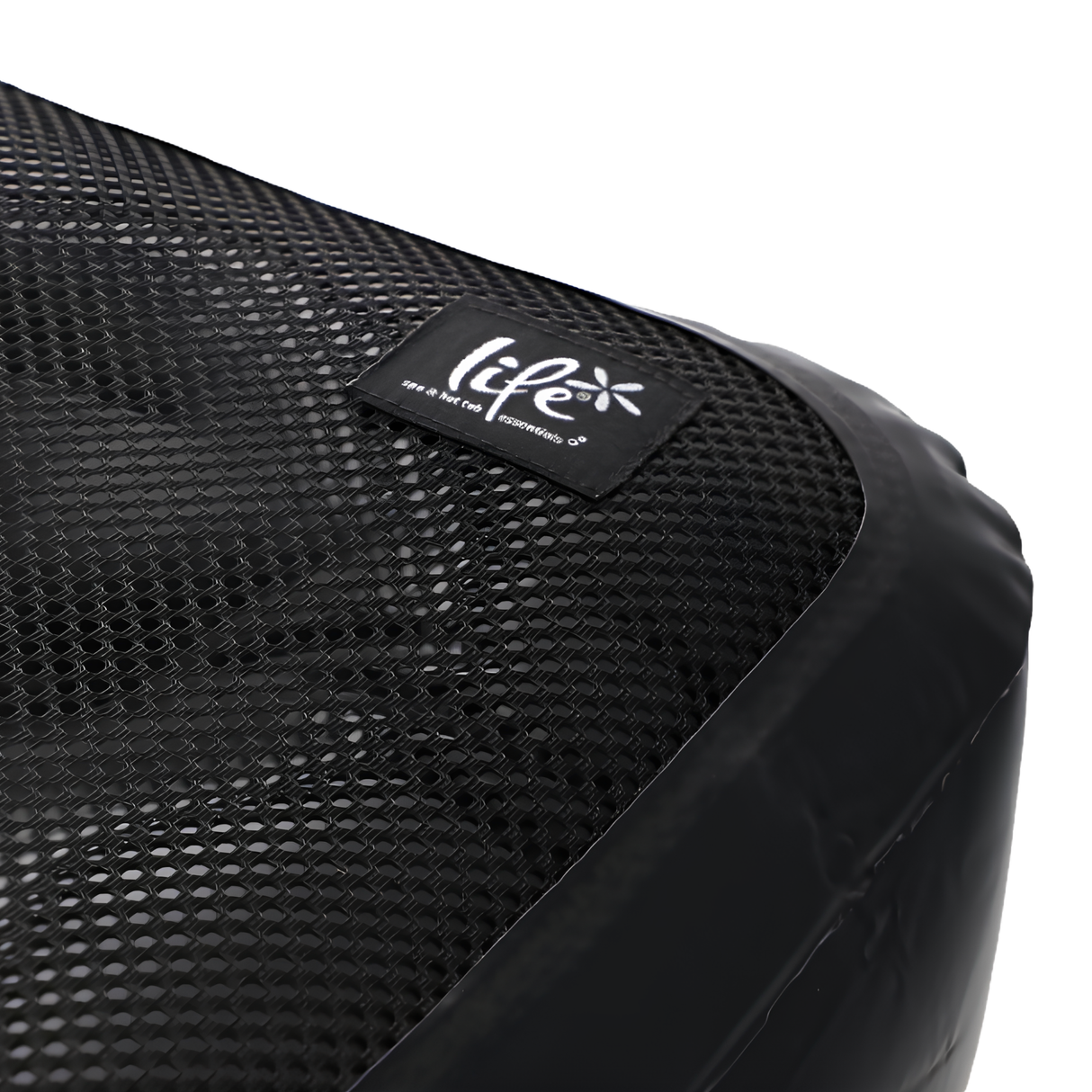 A detailed close-up studio shot of the corner of a black Life Spa Booster Seat, highlighting the textured weave of the chemical-resistant textilene mesh top and a black fabric brand label that reads Life Spa & Hot Tub Essentials.