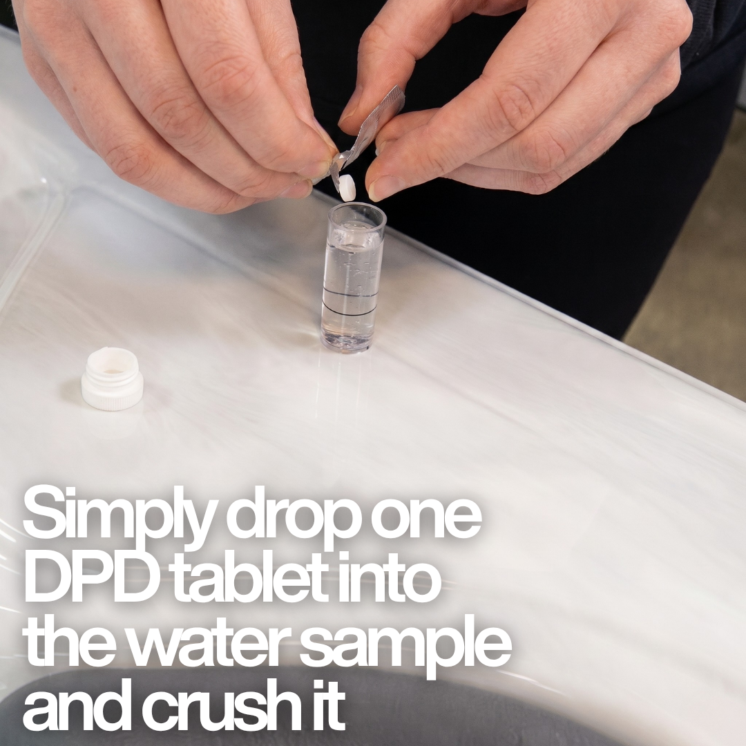 A person dropping a Lovibond DPD No. 1 Rapid tablet into a water sample vial with text: "Simply drop one DPD tablet into the water sample and crush it," demonstrating the manual testing process.