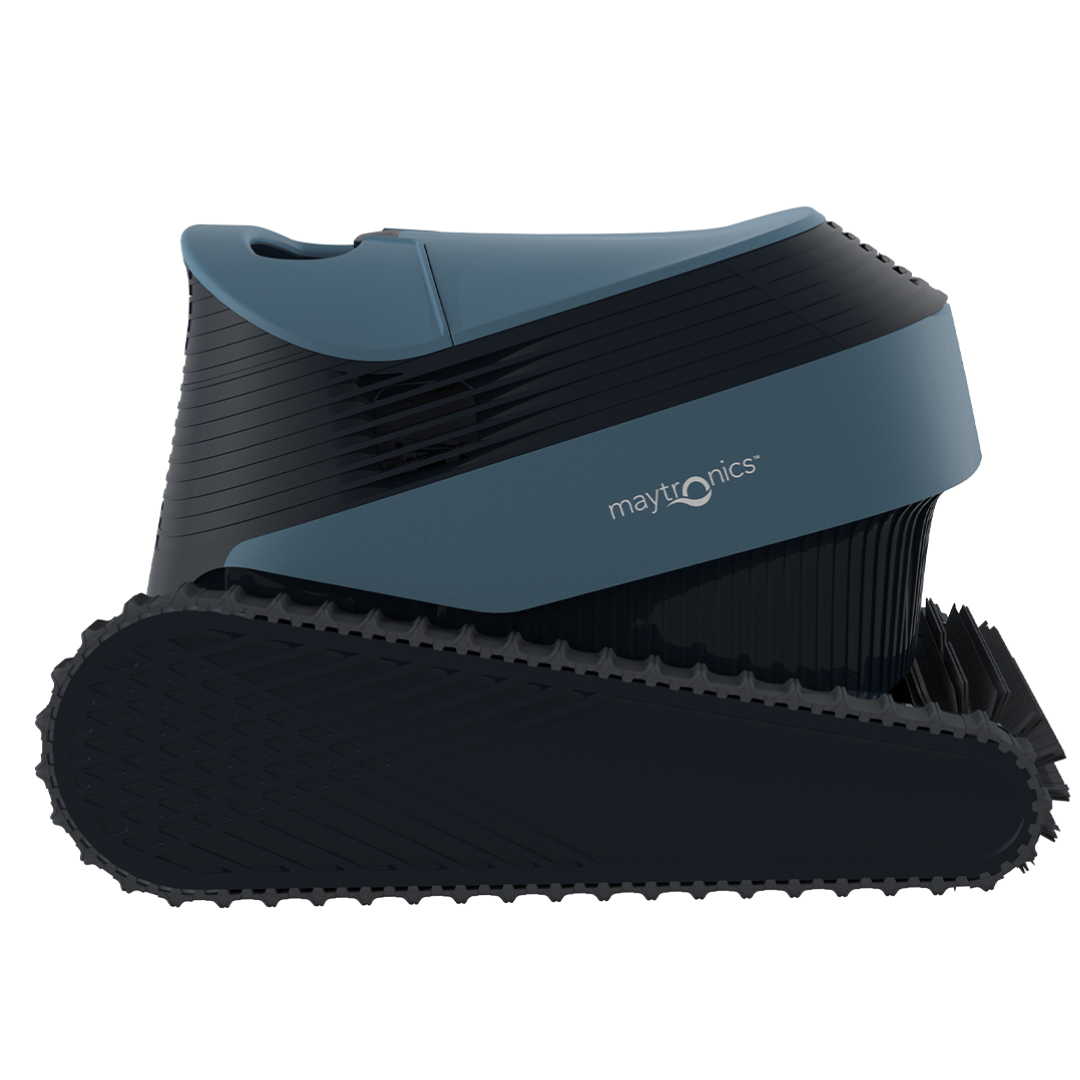 Side elevation studio product view of the Maytronics Dolphin S2000 robotic pool cleaner on an isolated white background, highlighting its continuous rubber track drive system, dark grey chassis, slate blue top casing with Maytronics branding, and front scrubbing brush profile.