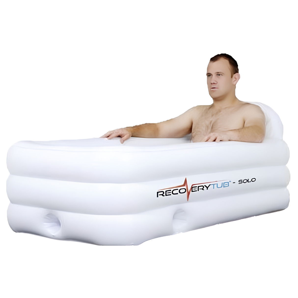 A man sitting inside a white rectangular inflatable RecoveryTub Solo ice bath designed for single-person athletic recovery, isolated against a plain white background.