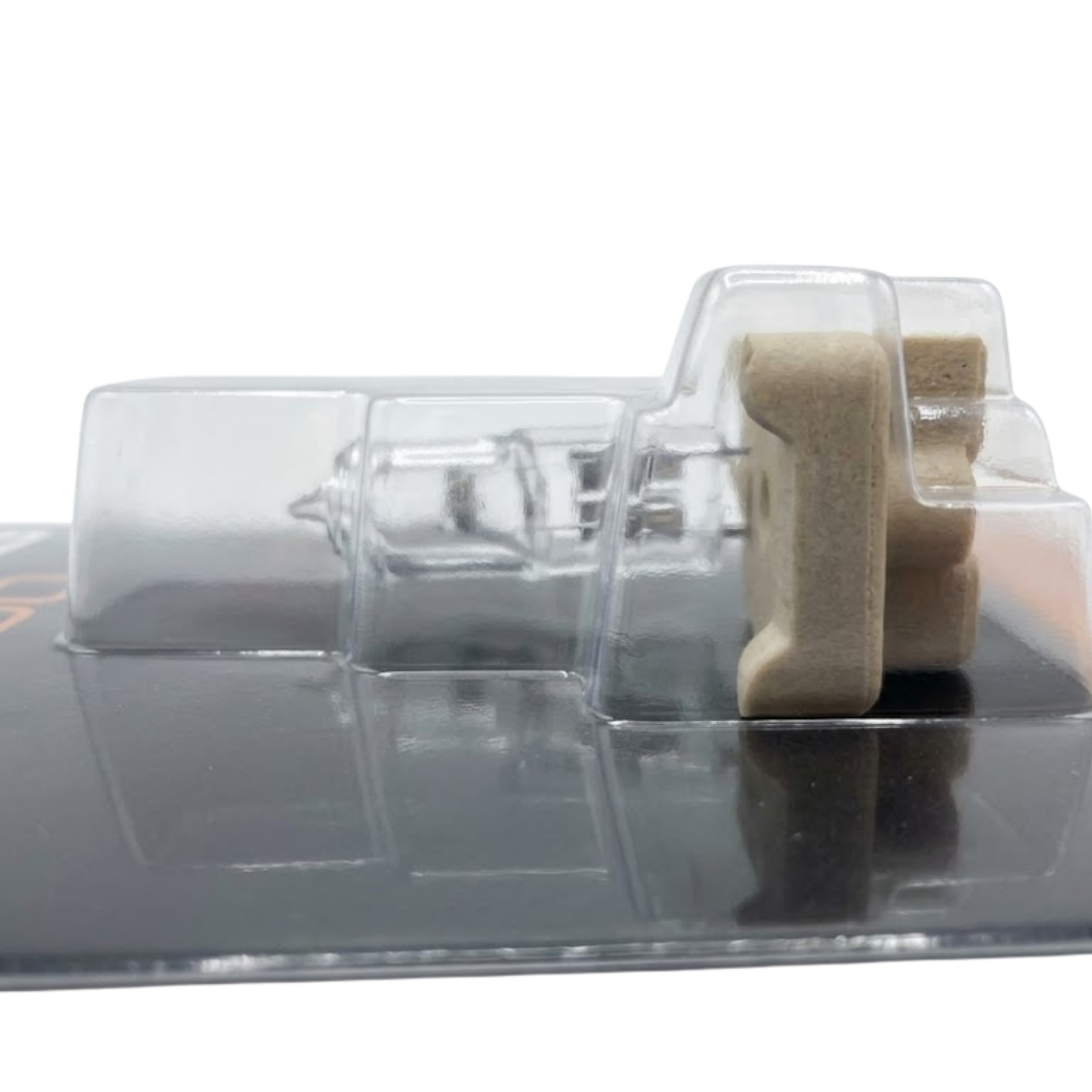 Alternate side profile view of a Spa Electrics 12V halogen globe and ceramic connector sealed inside clear blister packaging for WN250 swim spa light models.