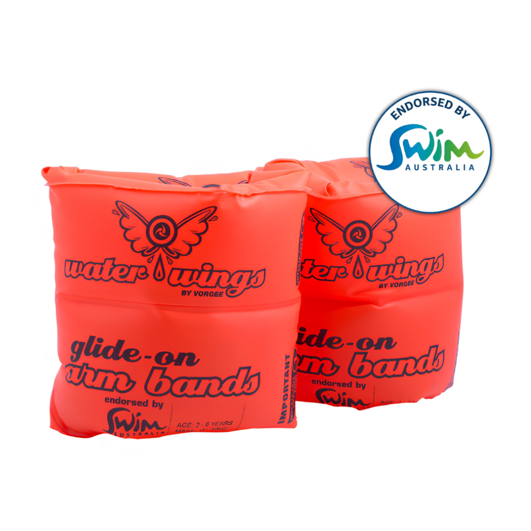 Studio product photo of a pair of bright orange Vorgee Water Wings glide-on inflatable arm bands for kids, endorsed by Swim Australia, on an isolated white background.
