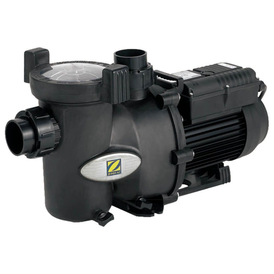 Front three-quarter studio view of a Zodiac FloPro SS 1.5 HP pool pump, highlighting the front quick-connect inlet union, silver Zodiac emblem, clear strainer pot lid, top outlet port, and black motor housing isolated on white.
