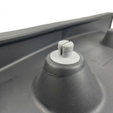 Macro close-up of a grey plastic snap-in mounting fastener pin on the back of an Artesian Elite lounge spa headrest pillow replacement.