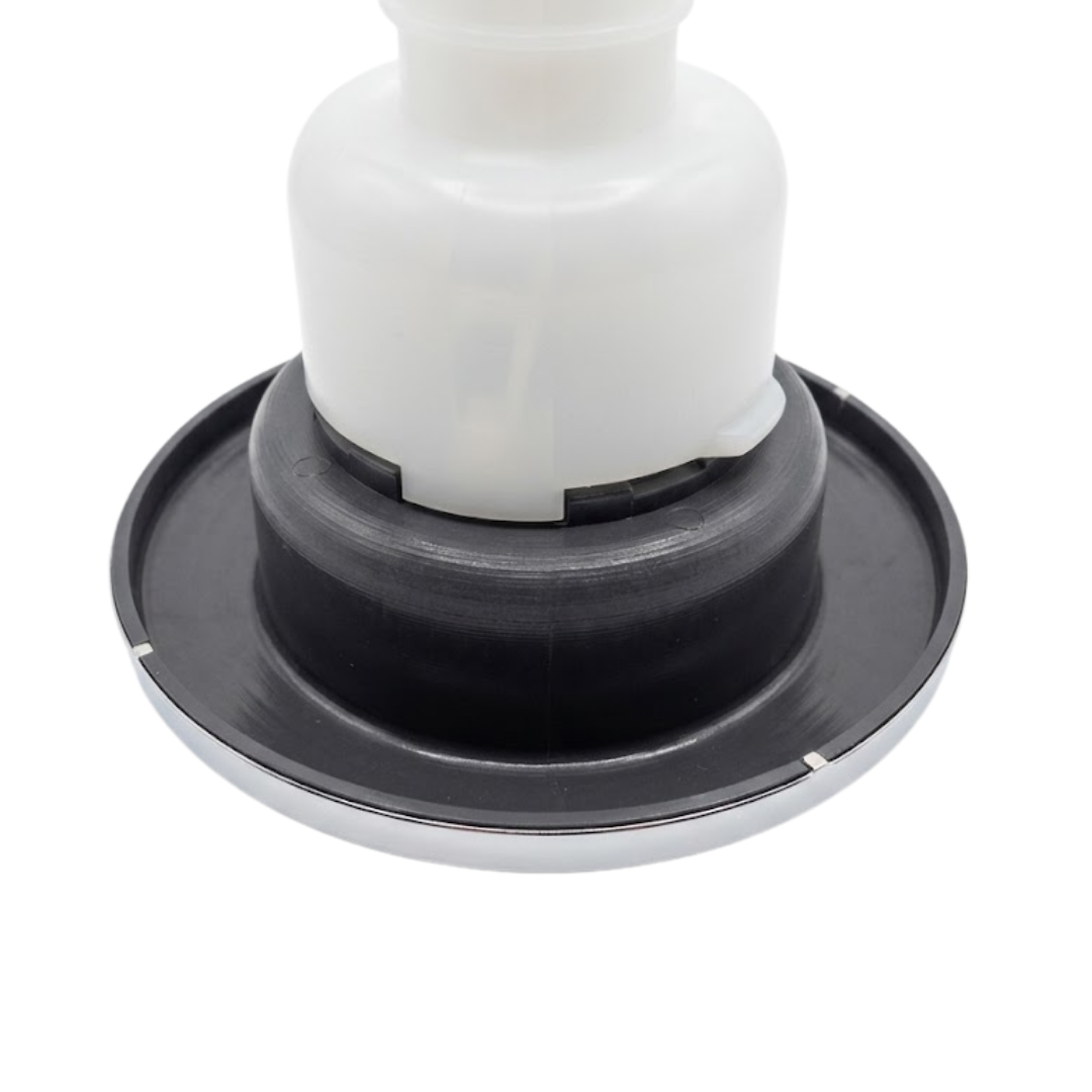 Close-up angled view of the rear face flange housing on an Artesian C-Helix 5 Whirlpool SS spa jet insert, showing the dark grey back flange ring, inner collar, and white main body casing.