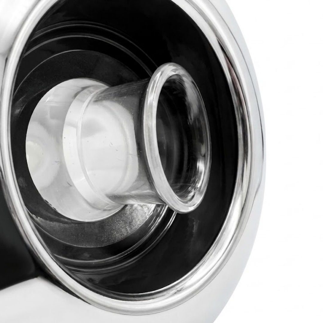Close-up angled view of the internal clear plastic whirlpool nozzle and dark housing on an Artesian C-Helix 5 Whirlpool SS spa jet insert, framed by a polished stainless steel bezel.
