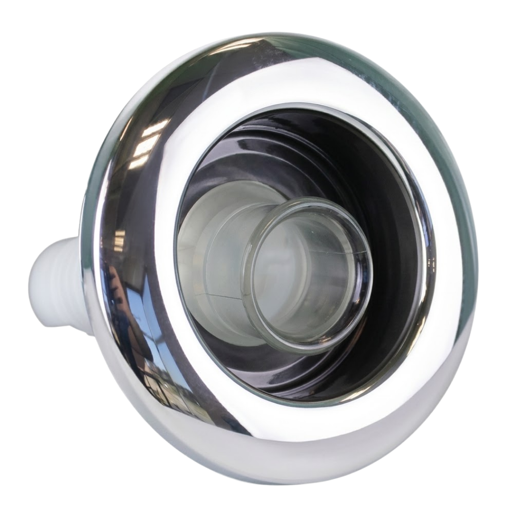 Three-quarter angled view of an Artesian C-Helix 5 Whirlpool SS spa jet insert, highlighting the smooth polished stainless steel bezel, dark inner housing, clear plastic whirlpool nozzle, and white rear stem.