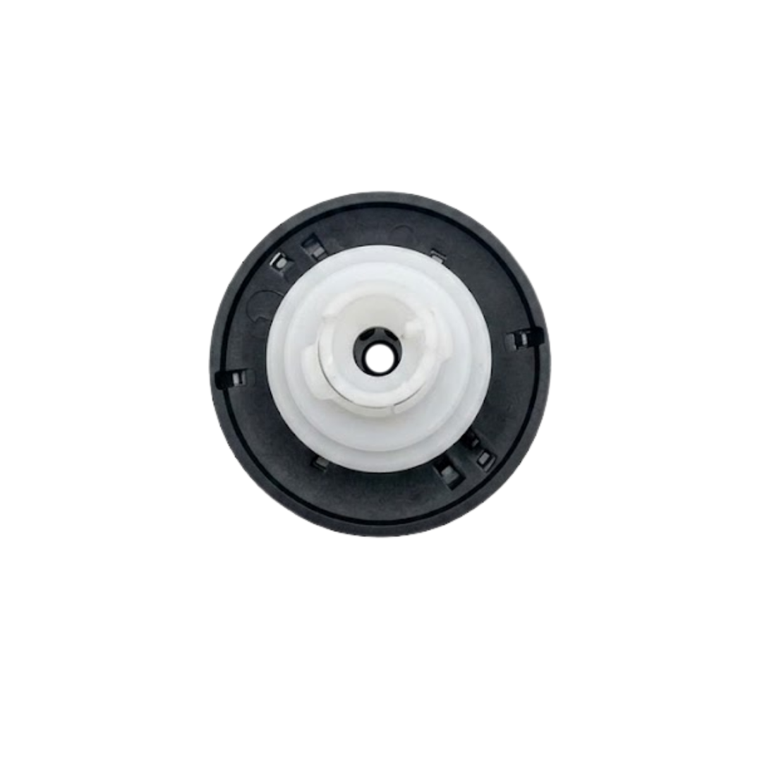 Direct overhead bottom-up view of the rear assembly on an Artesian Halo 3 Massage plastic spa jet insert, showing the black circular face housing ring and central translucent white plastic stem.