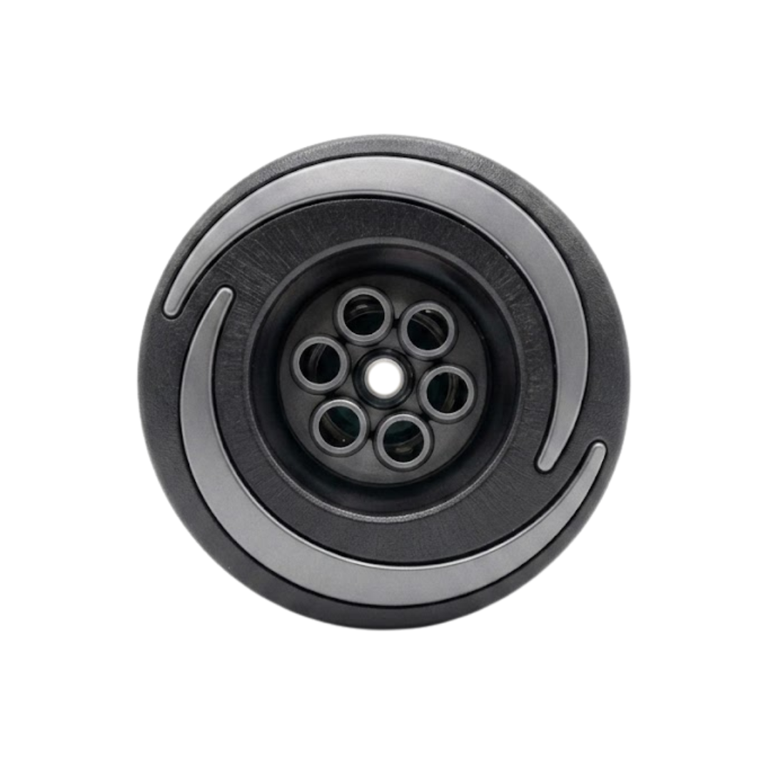 Direct overhead front view of an Artesian Halo 3 Massage plastic spa jet insert, featuring a textured black bezel with grey swirl accents and a central six-port massage nozzle cluster with a middle opening.