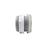 Horizontal side profile view of an assembled Artesian 2-inch Xylex/PVC light lens, displaying the front clear lens face, translucent gasket, threaded grey body, and white lock nut.