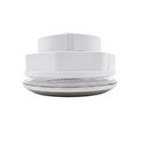 Side profile view of an assembled Artesian 5-inch stainless steel light housing, showing the front chrome rim, clear lens, gasket layer, and stepped white plastic rear casing.