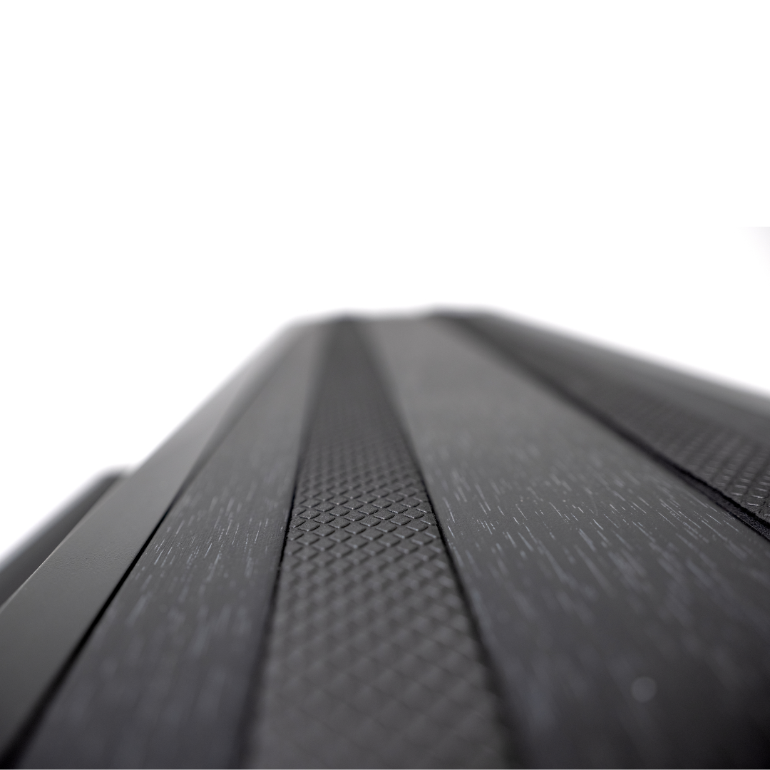 Extreme close-up macro view of black Artesian modular aluminium spa step tread pattern for enhanced slip resistance
