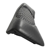 Side perspective view of a dark charcoal black foam replacement lounger headrest pillow for an Artesian hot tub, highlighting its contoured wedge shape, textured finish, and wavy-ridge insert details against a white background.