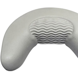 Close-up product shot of a grey curved foam replacement neck headrest pillow for an Artesian spa, detailing the left side contour and the center wavy ridge pad design.