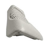 Side perspective view of a light grey foam replacement lounger headrest pillow for an Artesian hot tub, highlighting its contoured wedge shape, textured leather-grain finish, and wavy-ridge insert details against a white background.
