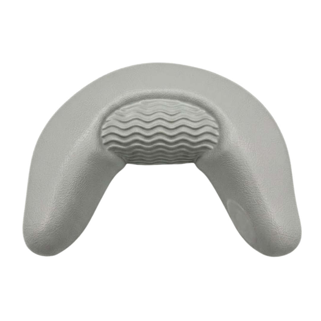 Front product shot of a replacement silver grey curved foam neck headrest pillow for Artesian spas, showcasing a wavy textured center insert and no brand logo.