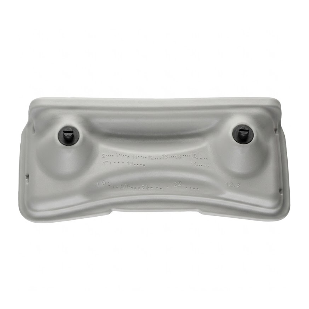 Rear view of a light grey foam replacement lounger headrest pillow for an Artesian hot tub, showing its molded back structure with two black attachment pins and stamped factory date codes.