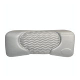 Front product shot of a light grey foam replacement lounger headrest pillow for an Artesian hot tub, featuring a textured faux-leather finish, a blank oval emblem insert, and a wavy-ridge center cushion pad against a white background.