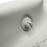 Close-up detail of a grey plastic clip-in mounting fastener stud on the reverse side of an Artesian spa large foam neck headrest pillow.