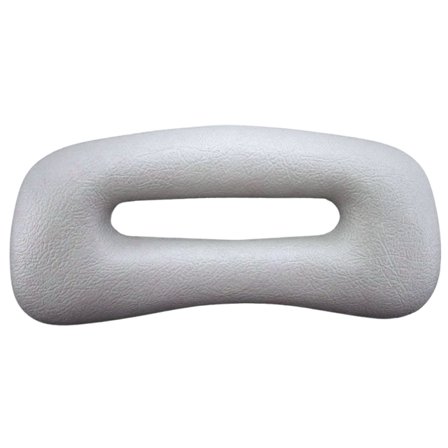 Front view of a grey rectangular replacement foam headrest pillow for an Artesian hot tub, featuring an elongated oval center cutout slot and a textured faux-leather surface against a white background.