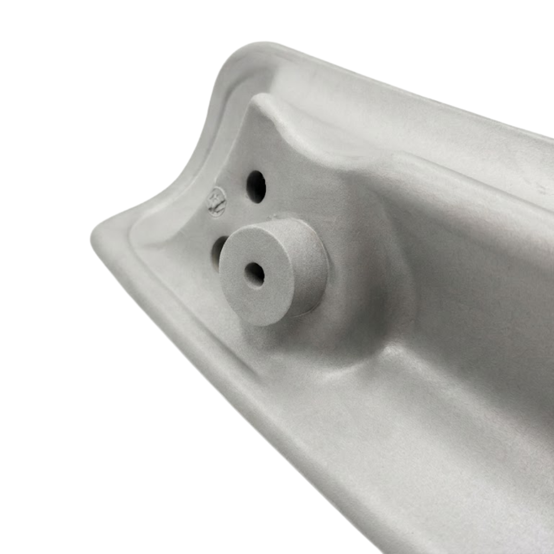 Close-up detail of the reverse side of a grey foam replacement wrap-around headrest pillow for an Artesian spa, showcasing a round molded mounting pin receptacle socket.