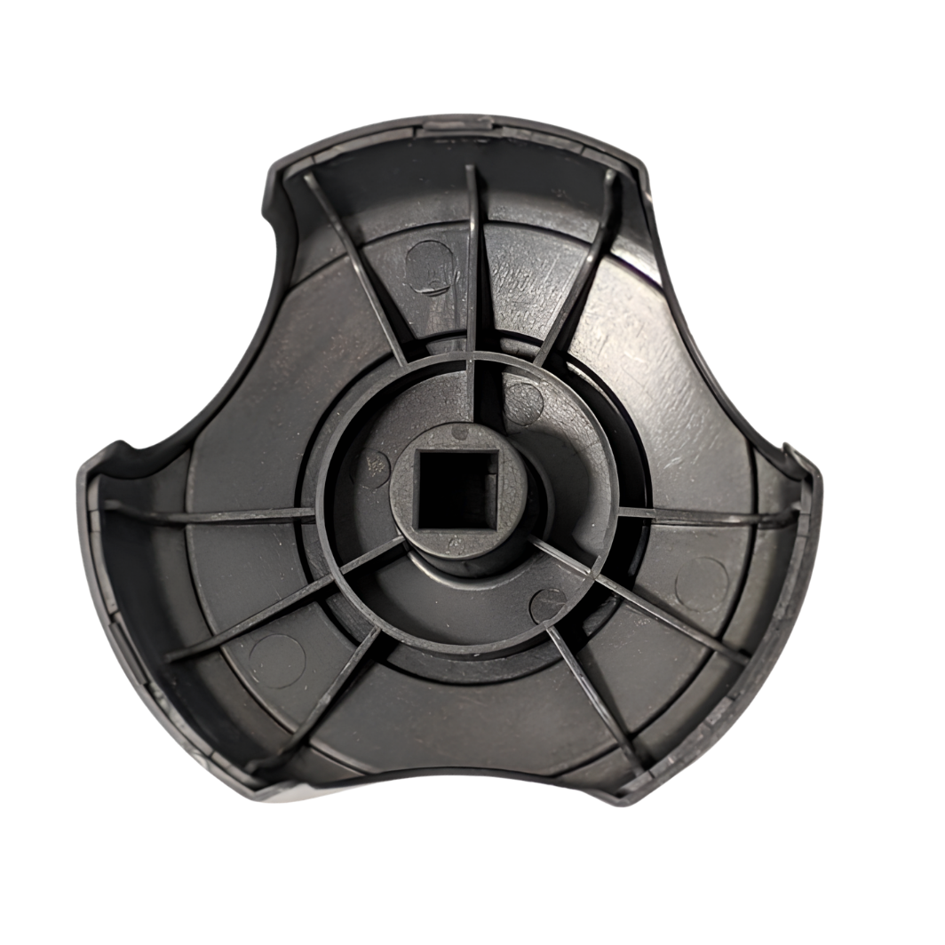 A top down overhead view of the underside of a black 2 inch Artesian Spas diverter valve replacement handle showing the square center stem mount and symmetrical plastic support ribs