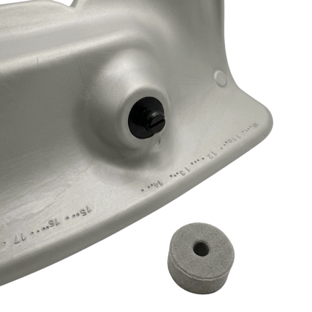Close-up of the rear mounting hardware for an Artesian Spas Island series wrap headrest pillow, showing the black plastic attachment screw and a detached foam mounting plug.