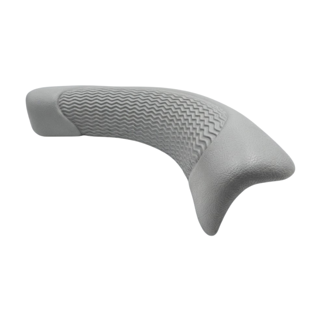 Side angle view of an Artesian Spas Island series wrap headrest pillow in charcoal gray highlighting its ergonomic curved shape and textured surface.